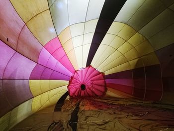 Multi colored hot air balloons in field