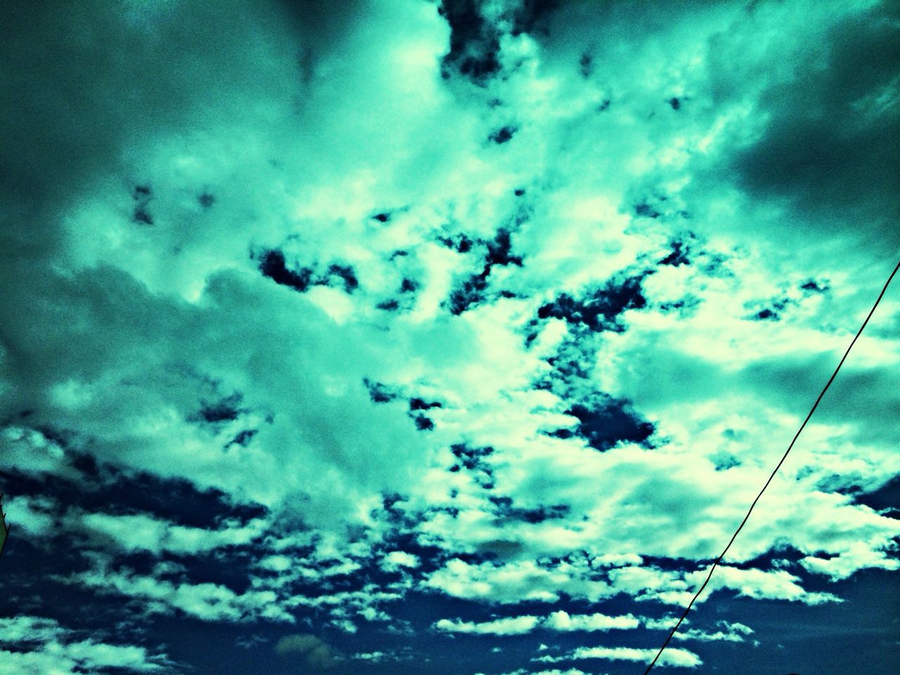 sky, cloud - sky, low angle view, cloudy, cloud, beauty in nature, nature, weather, tranquility, blue, scenics, tranquil scene, cloudscape, overcast, power line, outdoors, dusk, no people, day, idyllic