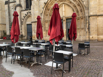 Empty chairs and tables in cafe