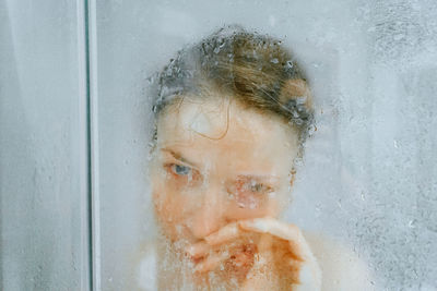 Close-up portrait of girl in bathroom