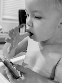 Close-up of baby boy eating food