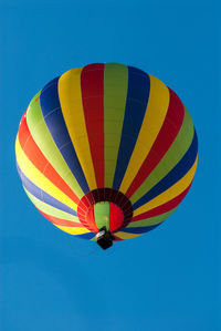 Low angle view of hot air balloon against blue sky