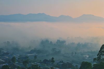 Aerial view of city during foggy weather