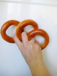 Close-up of hand holding tomato