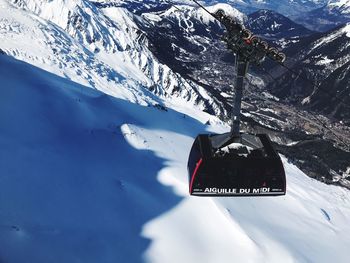 Information sign on snow covered mountain