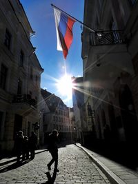 People on street in city during sunny day