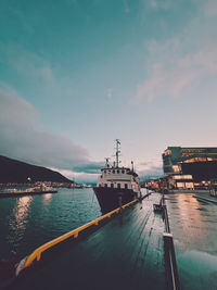 Boats moored at harbor