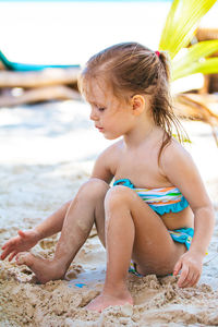 Cute boy playing on beach