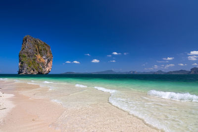 View of beach against blue sky