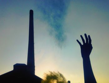 Silhouette of woman at sunset