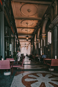 Empty chairs and tables in building
