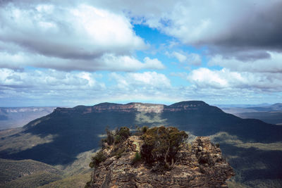 Scenic view of landscape against cloudy sky