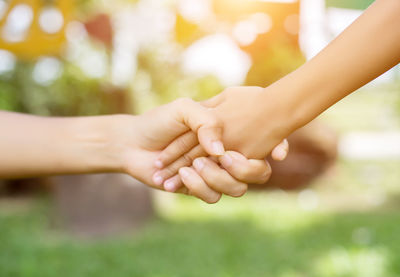 Close-up of hands holding finger