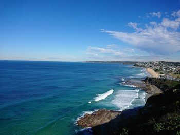 Scenic view of sea against blue sky