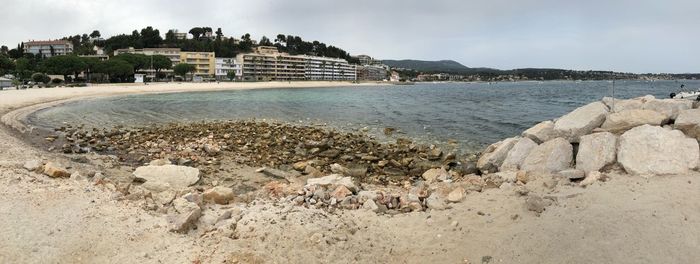 Scenic view of sea and rocks against sky