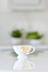 Close-up of coffee cup on table