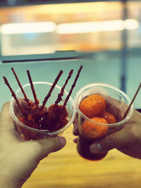 Close-up of hand holding drink