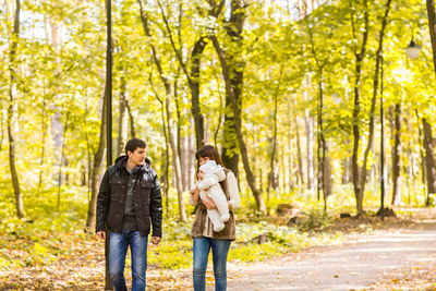 Young couple standing in forest