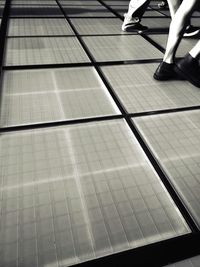 Low section of woman on tiled floor