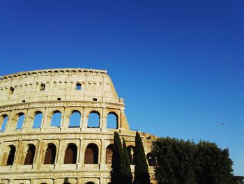 Low angle view of historical building against blue sky