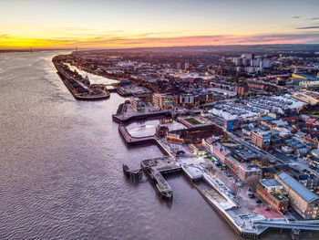 High angle view of city buildings during sunset