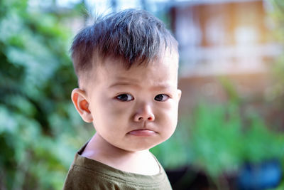 Close up of asian child boy's face with tears. upset crying and mad little toddler boy. 