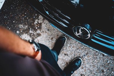 Low section of man legs on car