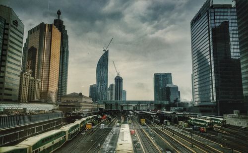 City skyline against cloudy sky