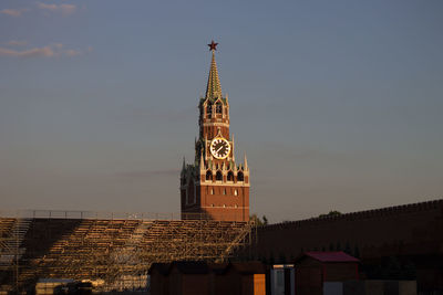 Low angle view of kremlin clock tower against sky during sunset