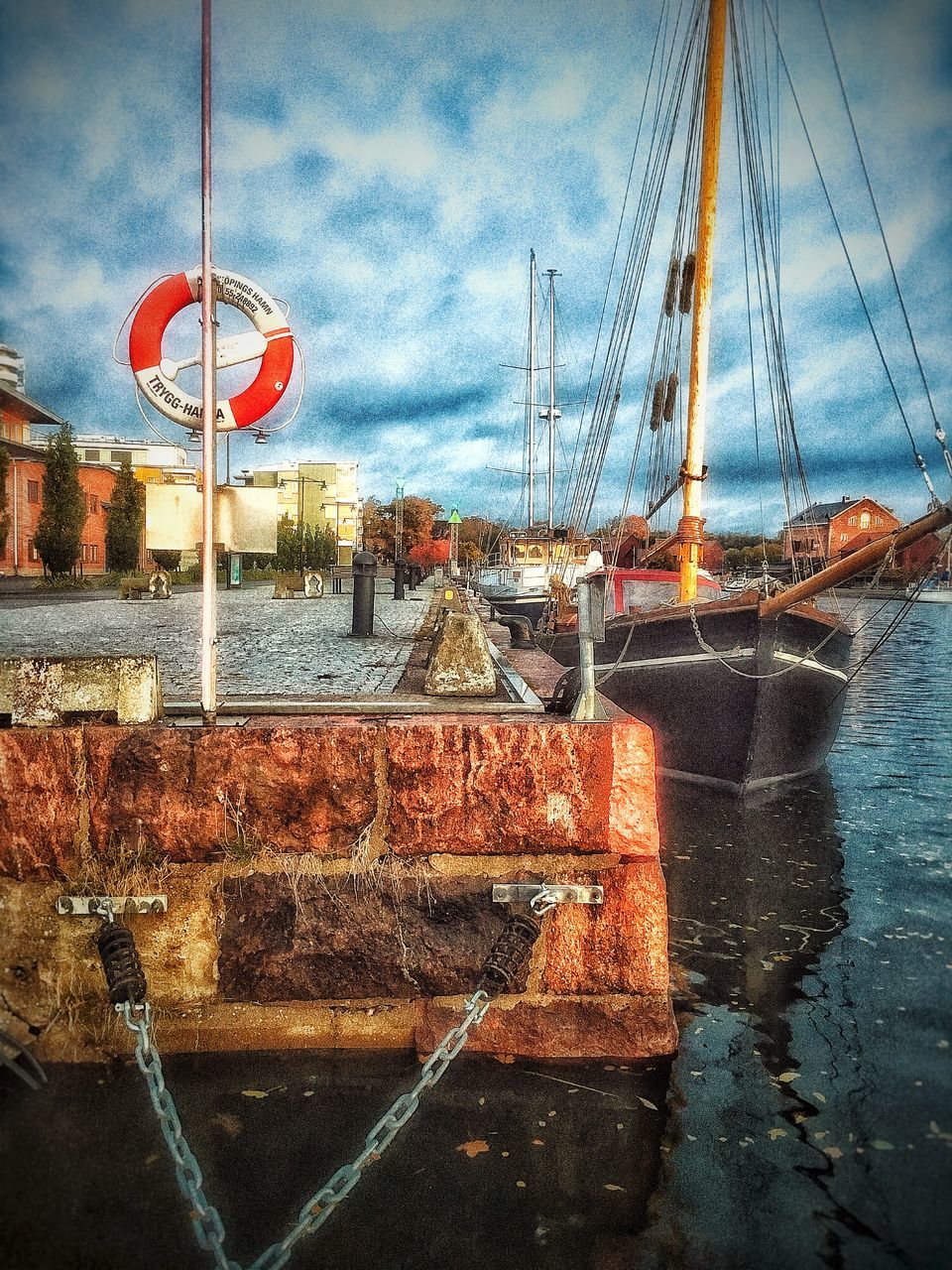 VIEW OF FISHING BOATS MOORED IN SEA