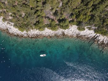 High angle view of sailboats on sea shore