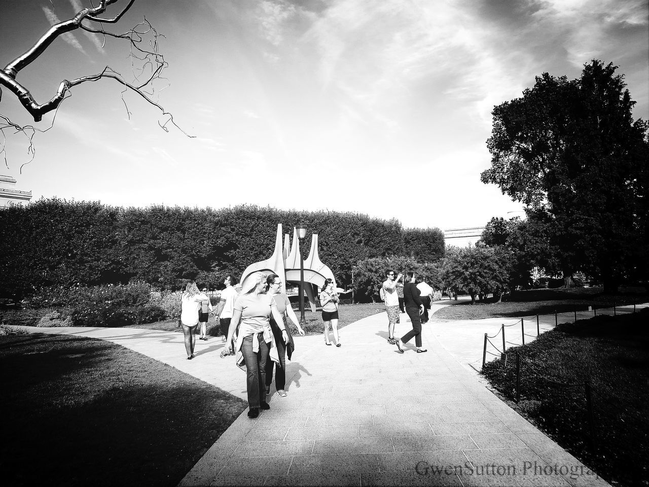 WOMAN WALKING ON FOOTPATH