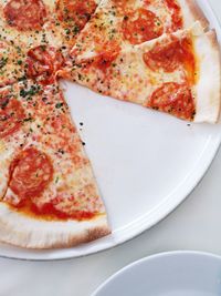 High angle view of pizza in plate on table