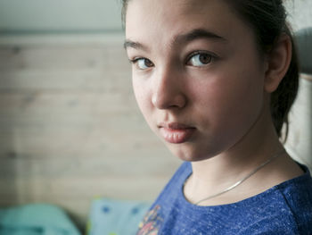 Close-up portrait of girl at home