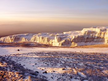 Aerial view of frozen sea against sky during winter