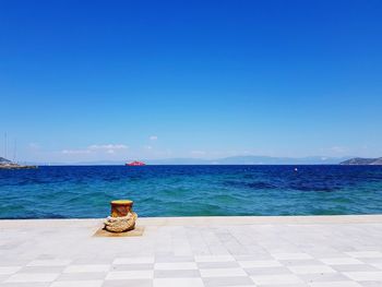 Scenic view of sea against clear blue sky