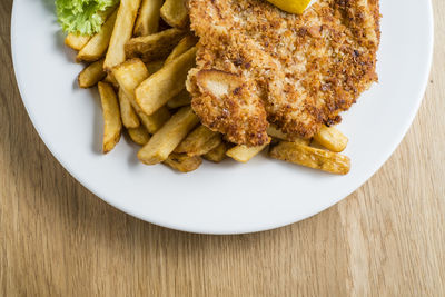 High angle view of meat served in plate on table