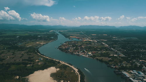 High angle view of river amidst city against sky