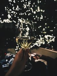 Close-up of hand holding glass of wine