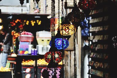 Illuminated lanterns hanging in market