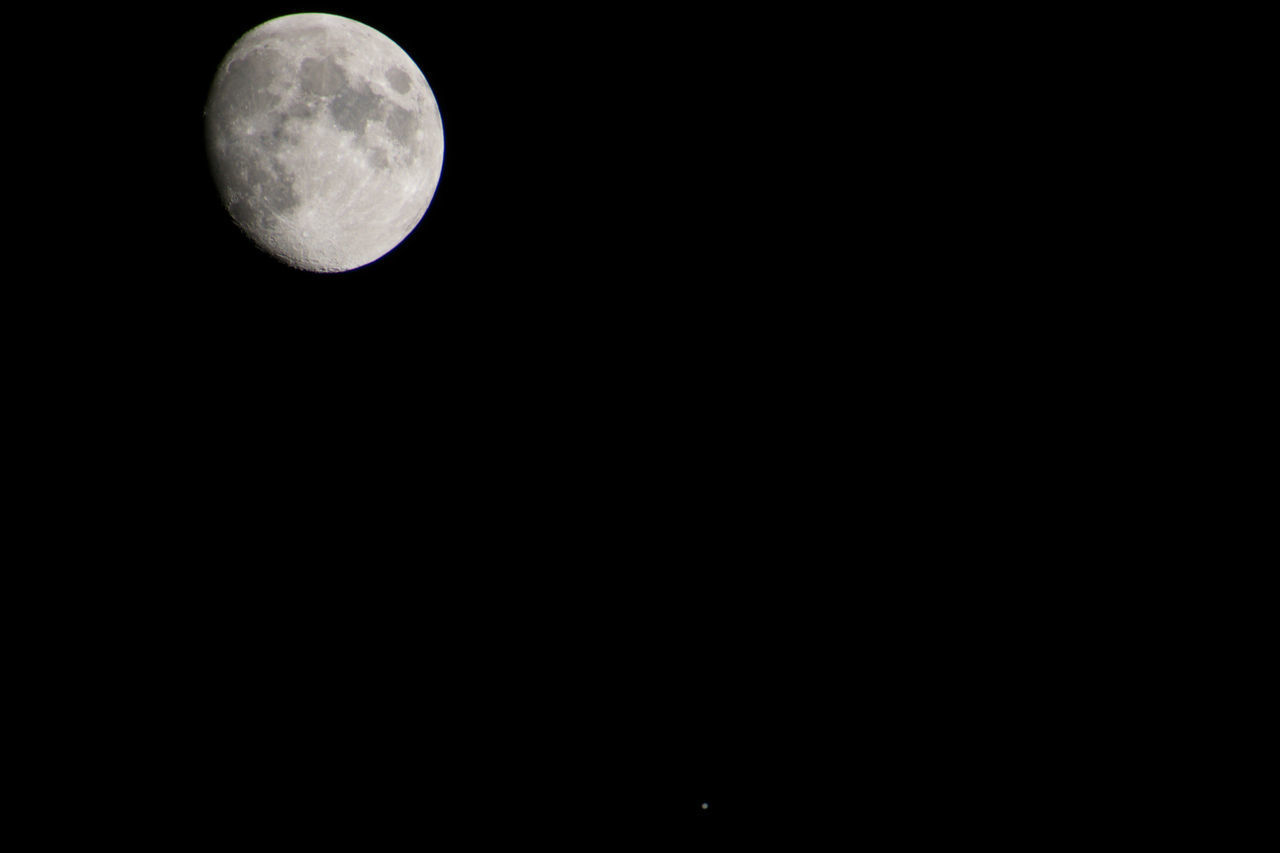 LOW ANGLE VIEW OF MOON IN SKY