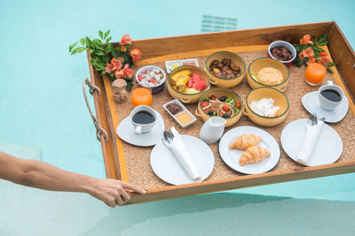 High angle view of person preparing food on table