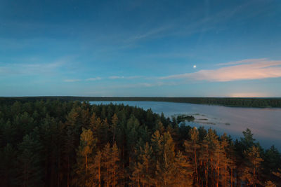 Scenic view of lake against blue sky