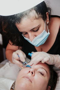 Woman working with tattoo