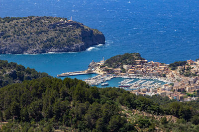 High angle view of townscape by sea