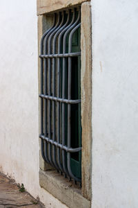 Close-up of closed window of old building