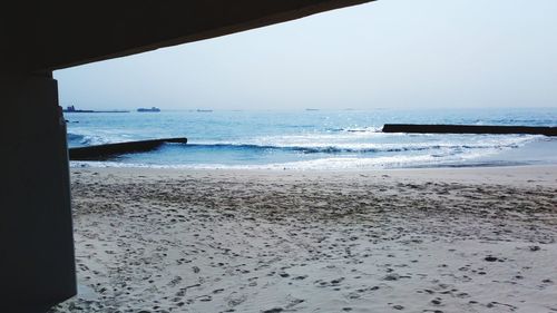 Scenic view of beach against clear sky