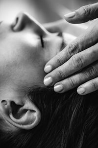Cranial osteopathy massage. therapist massaging womans head.