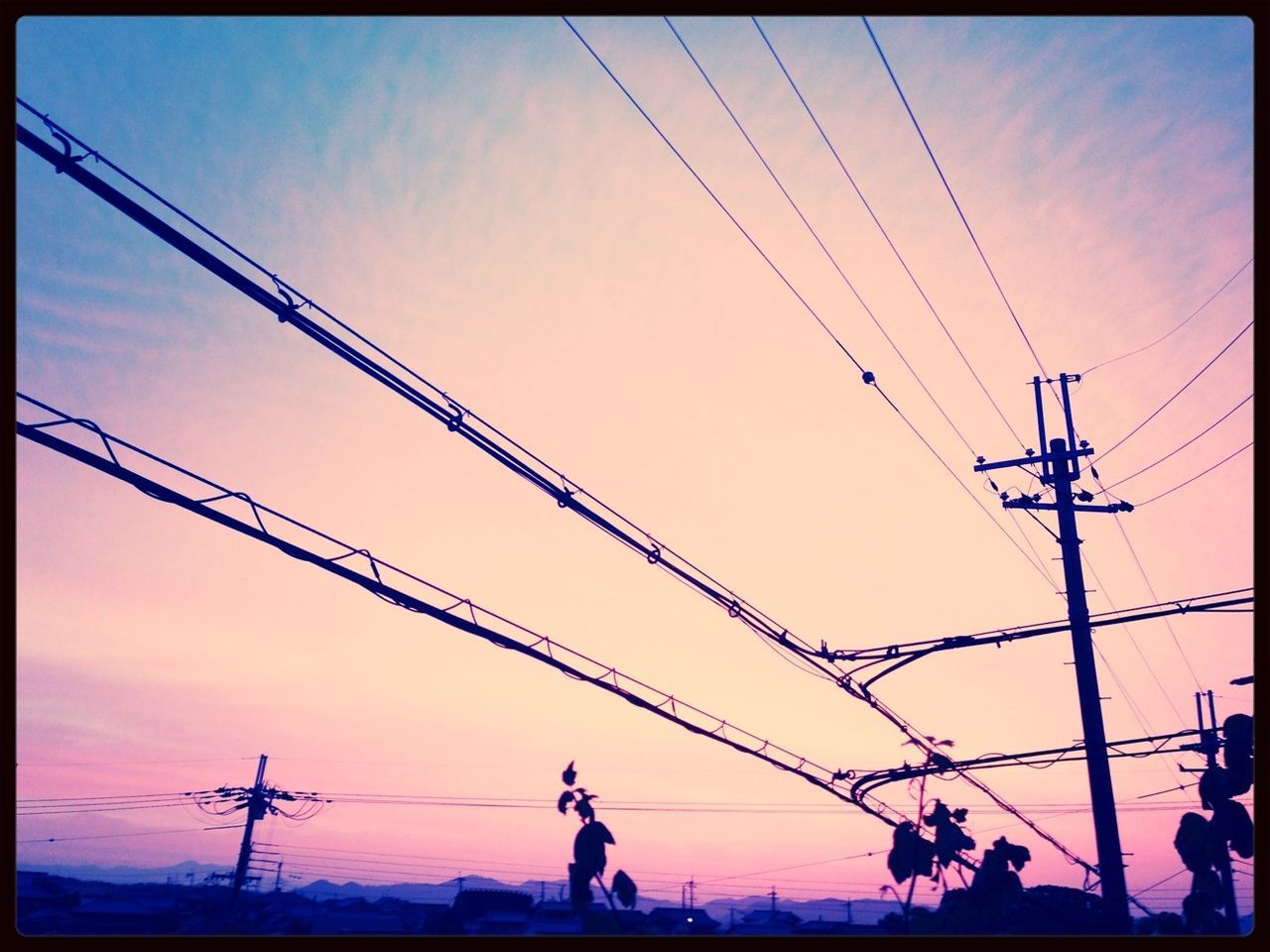 transfer print, sky, sunset, power line, low angle view, silhouette, auto post production filter, sculpture, human representation, statue, electricity pylon, creativity, art and craft, technology, power supply, art, cable, cloud - sky, outdoors