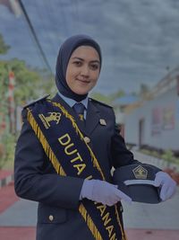 Beautiful woman in uniform in open space